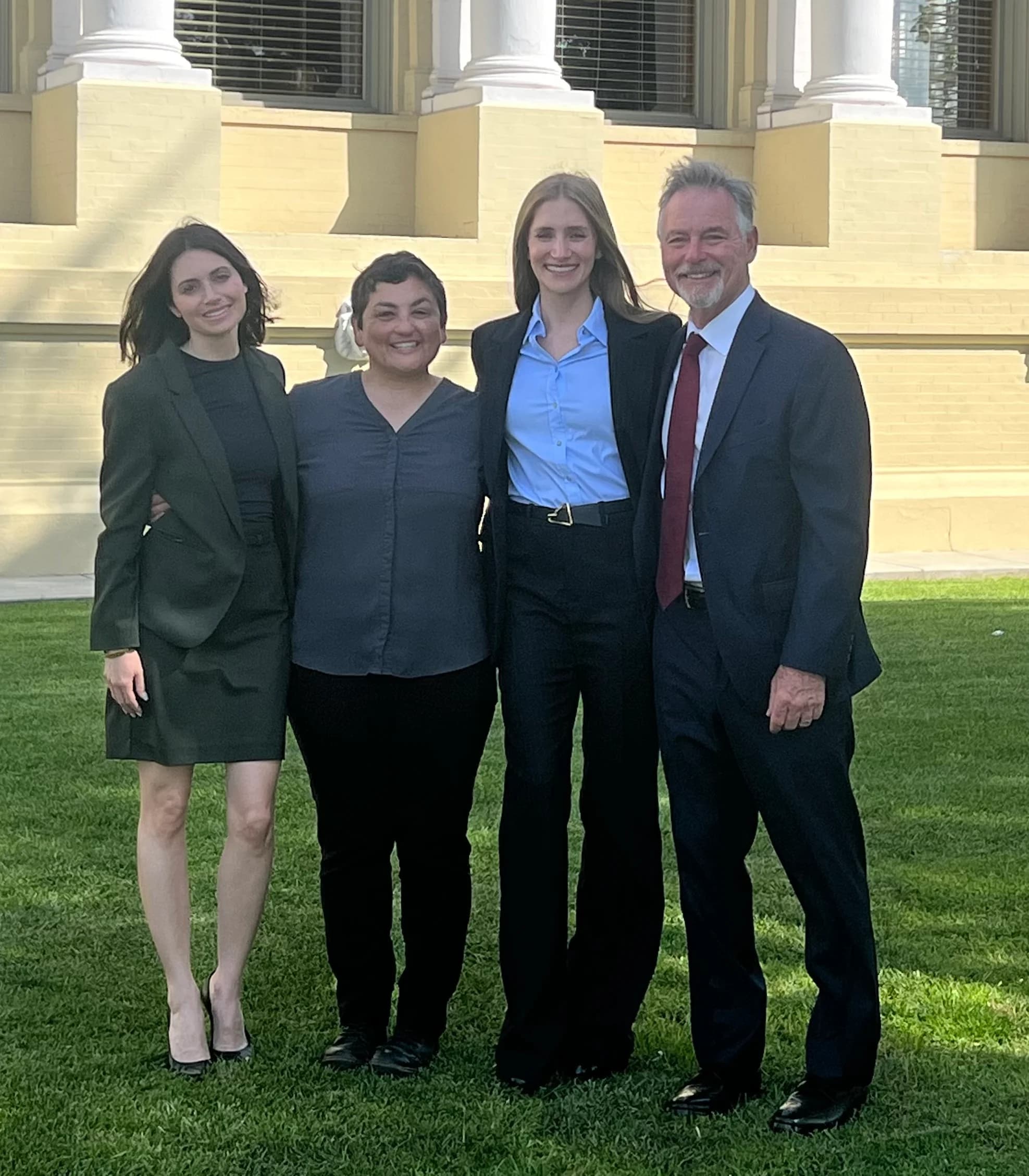 Dordick Law attorneys with a client after a published verdict